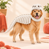 Golden Retriever in the white plush dinosaur skeleton costume, side view