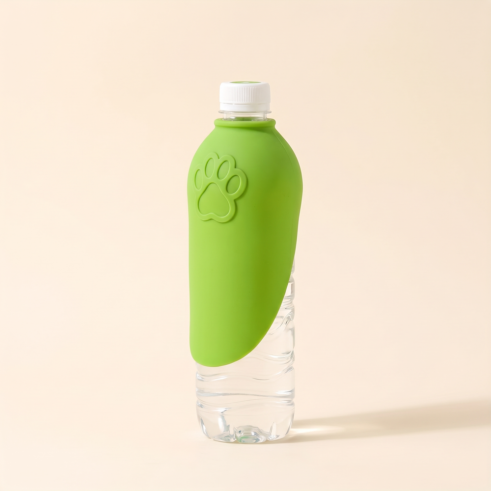 Green silicone dog drinking tray folded closed on a water bottle