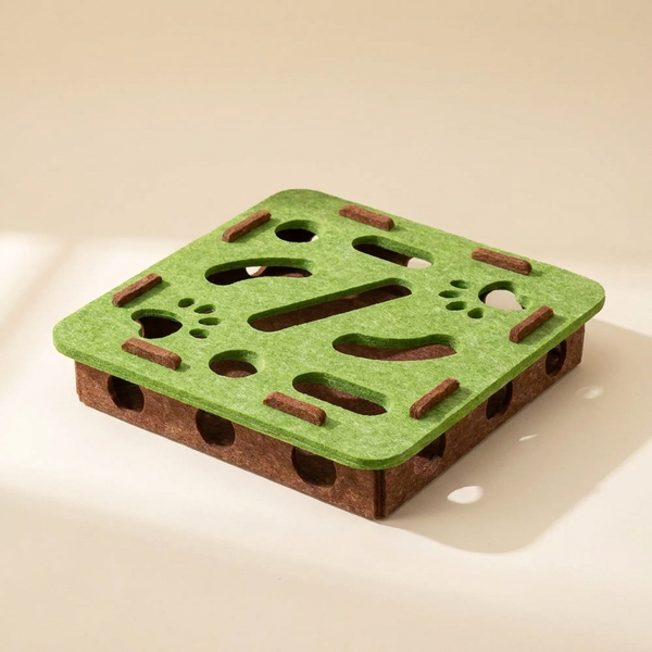 Felt puzzle box cat toy on cream studio background