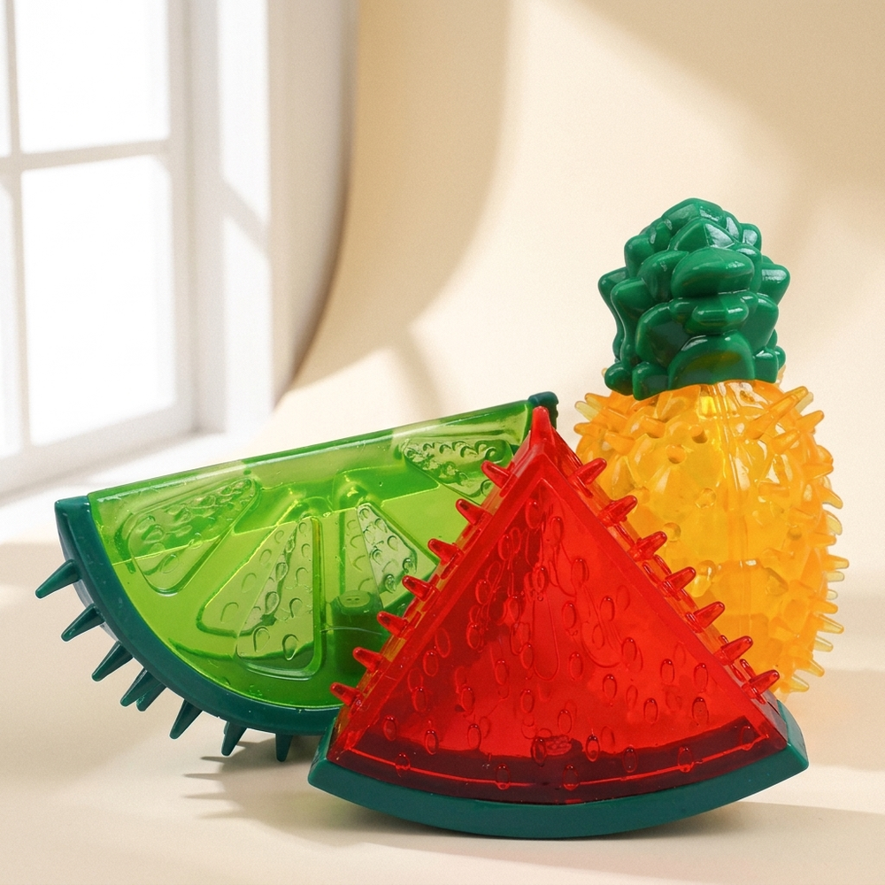Freezable fruit chew toys for dogs and cats on cream studio background