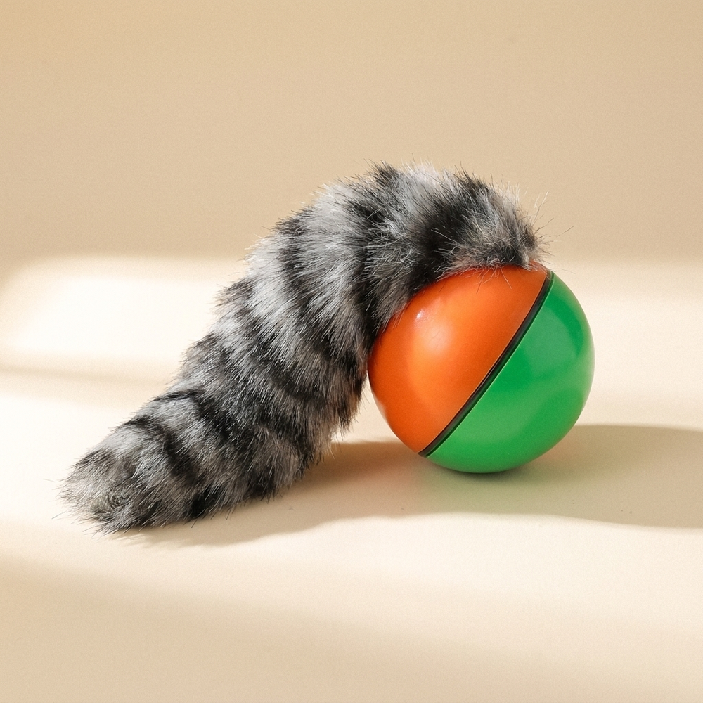 Interactive rolling ball toy for dogs and cats on cream studio background