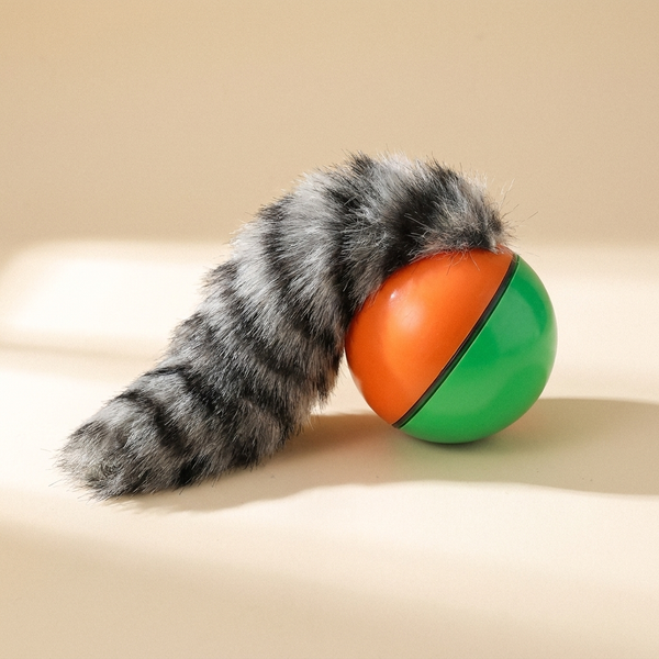 Interactive rolling ball toy for dogs and cats on cream studio background
