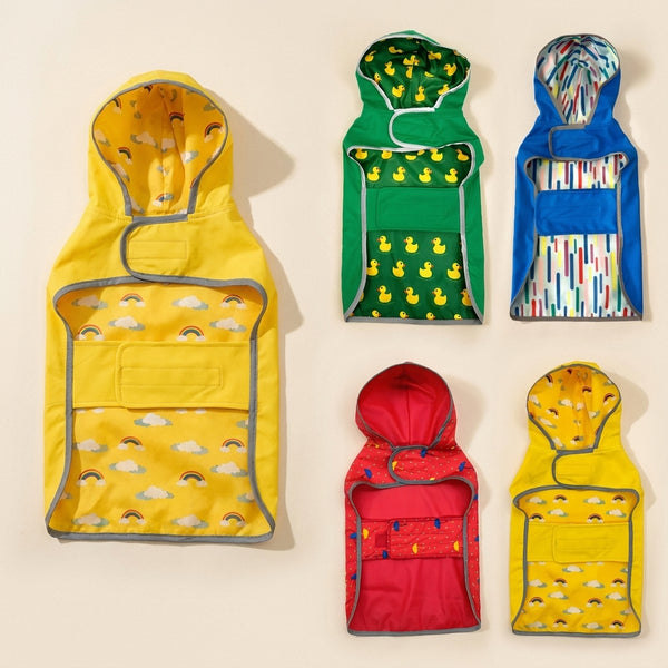 Double-layer reversible dog raincoat on a cream studio background