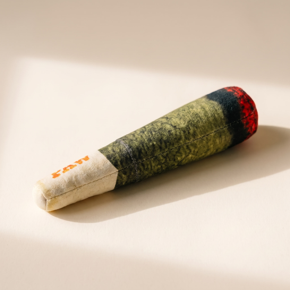 Joint-shaped novelty plush dog toy, second angle showing the green body and red end