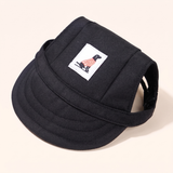 Black dog baseball cap with a curved visor and small dog-patch label