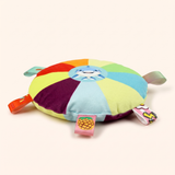 Squeaky plush flying disc dog toy, shark design, side view showing the ribbon tabs