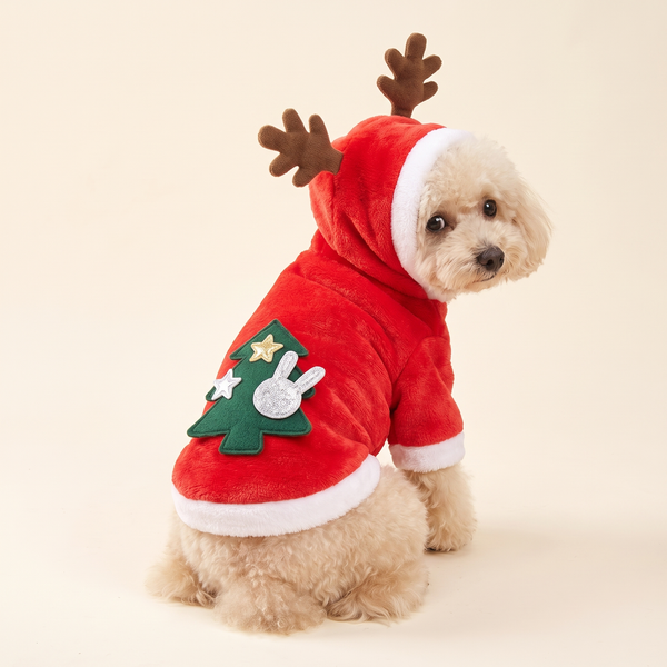 Dog wearing the red plush reindeer hoodie, Christmas tree applique on the back